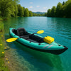 Premium blue and yellow inflatable kayak on turquoise lake with green trees, wildflowers, and distant mountains