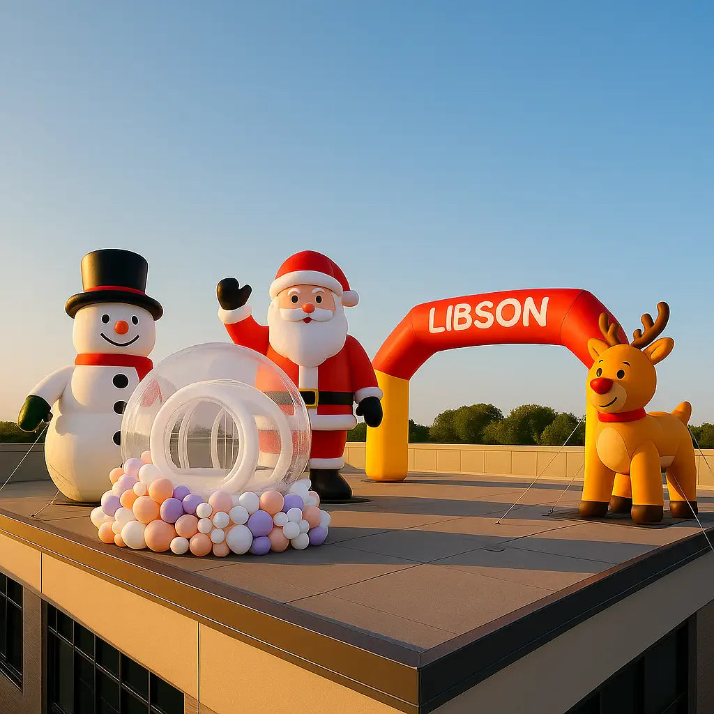 Sunlit rooftop with colorful holiday promo inflatables secured on a modern commercial building, blue sky background