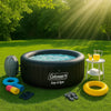 Sunny backyard with inflatable hot tub, colorful towels, pool floats, and dappled sunlight on green lawn